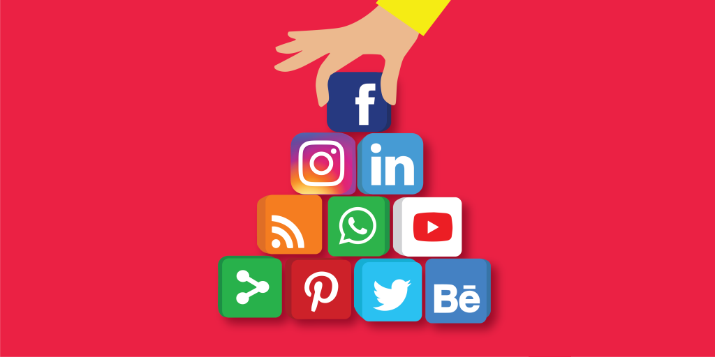 Hand arranging social media blocks
